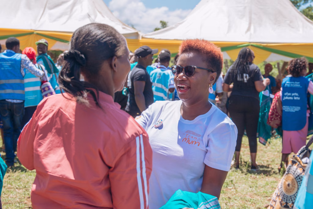 Cherio Onacha embracing a pregnancy support group participant at a Child.org community event in Meru, Kenya